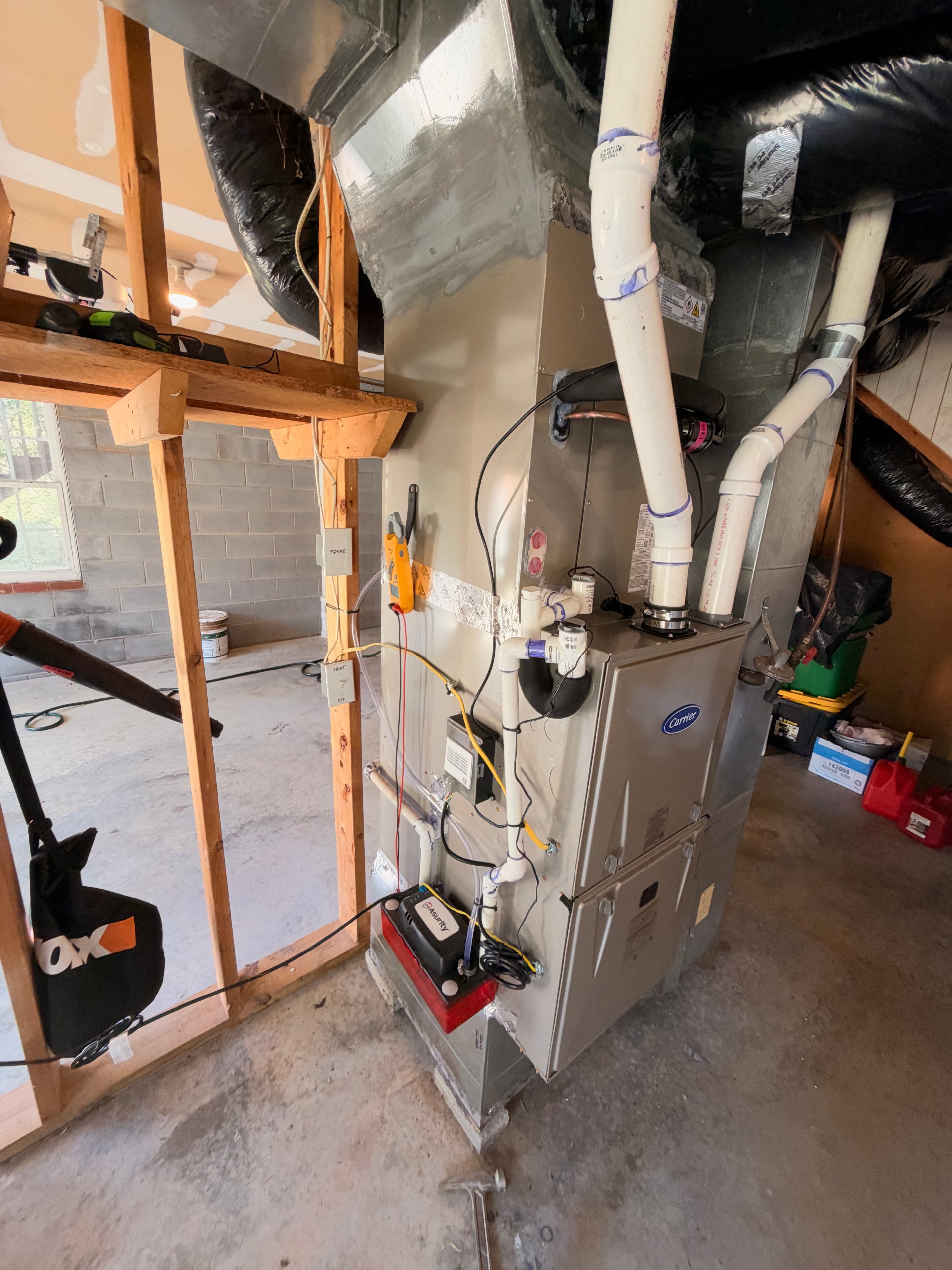 Carrier high-efficiency furnace installed in garage utility space